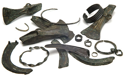 Bronze Age hoard comprising sickles, palstaves, bracelets and rings found in peat near Edington Burtle, Somerset